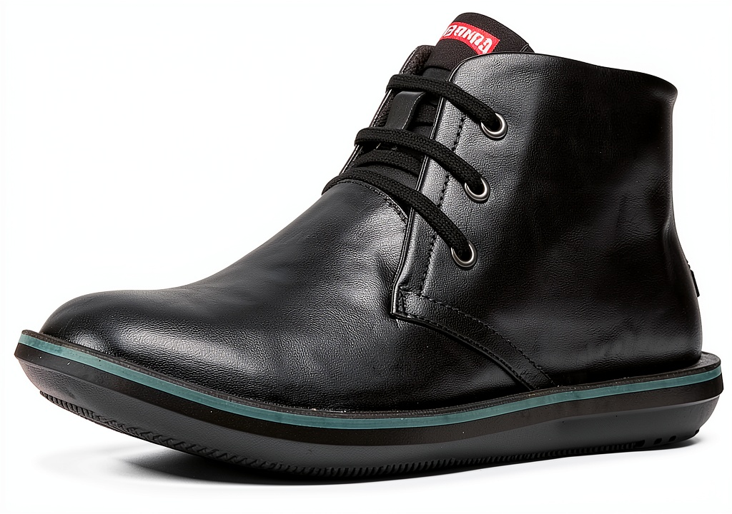 Camper black chukka boots on a neutral background