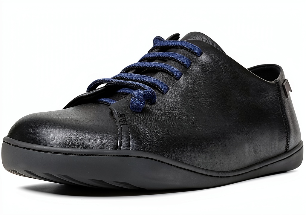 Camper men's leather sneakers in Black color on a neutral background